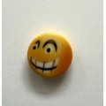 Smiley knap overrasket